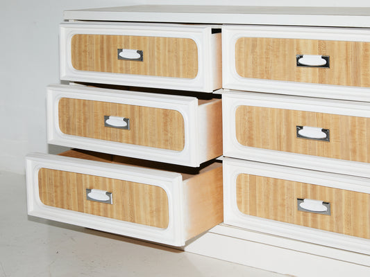 Faux wood formica dresser with 3 drawers slightly ajar and 3 drawers closed