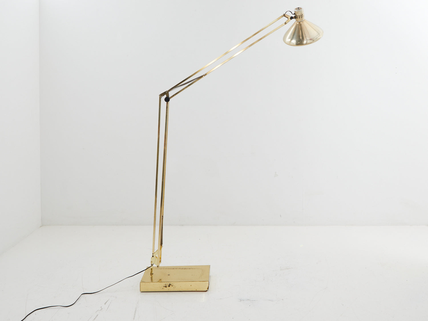 Brass adjustable floor lamp from the side