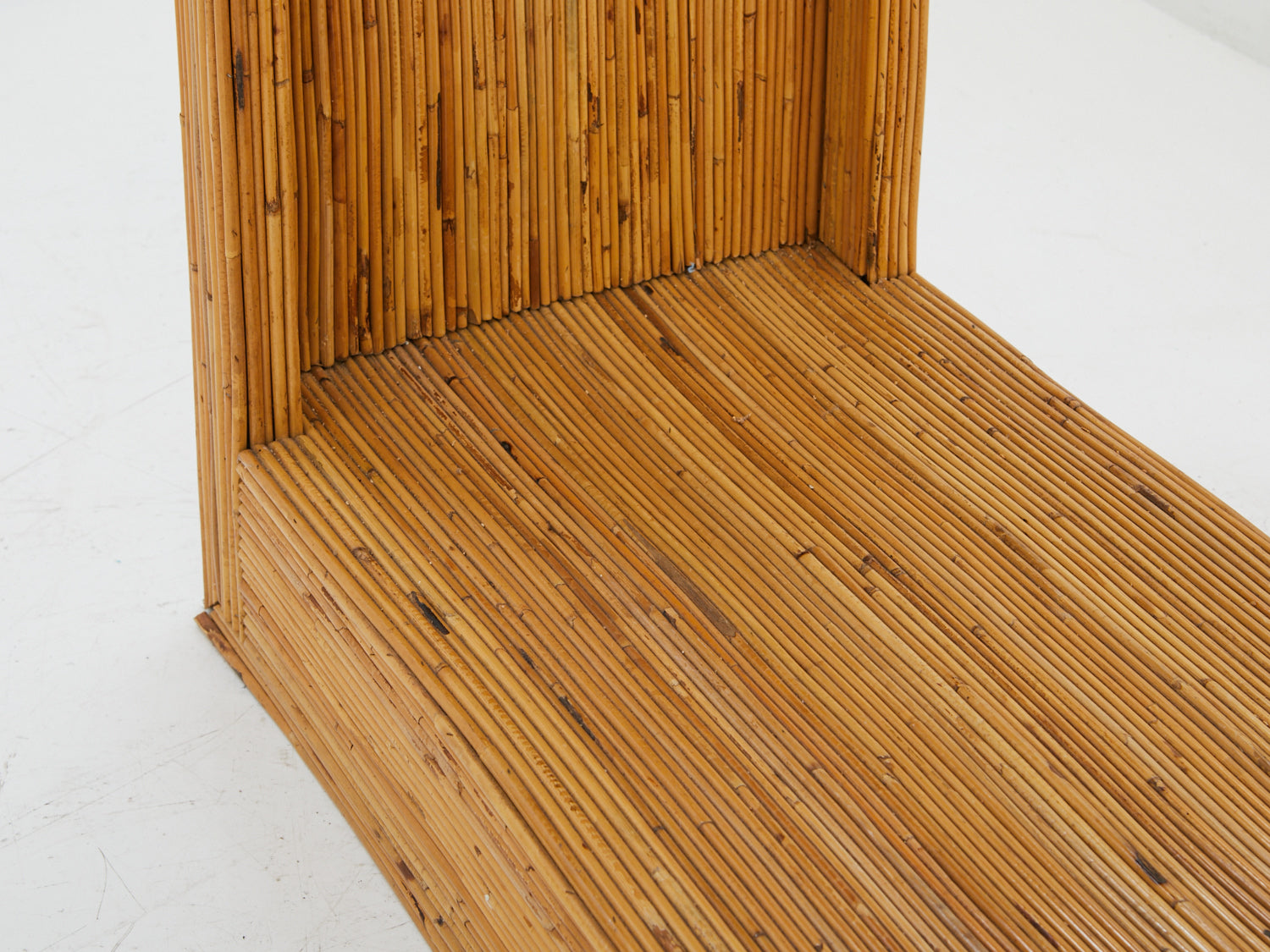 Close up of the base of a Pencil Reed Etagere from the 1970s