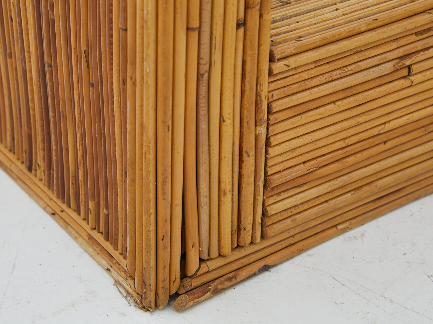 Close up to the base of a Pencil Reed Etagere from the 1970s