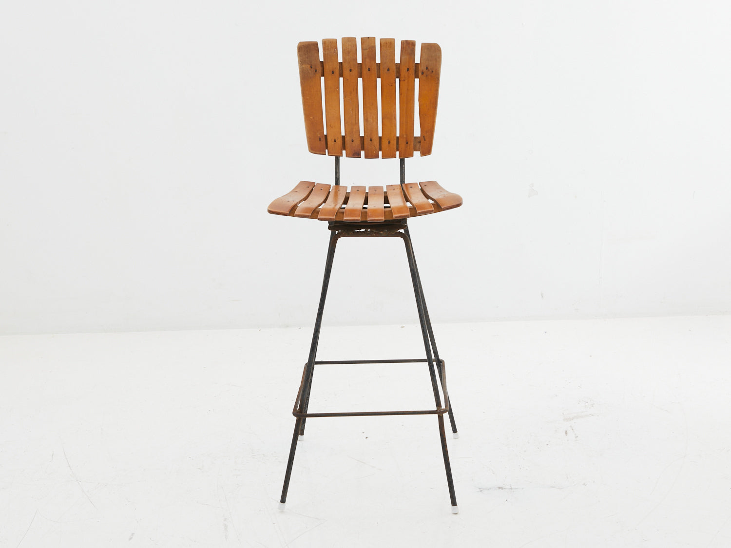 Wood slatted stool with iron seat base by Arthur Umanoff