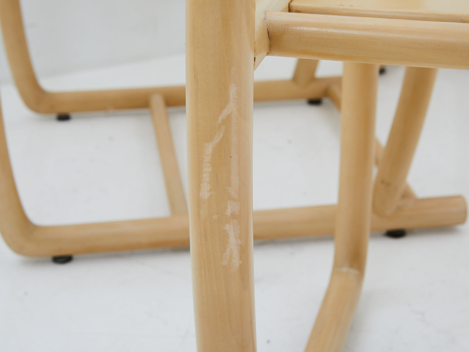 Close up of damage to Italian bentwood chair by Tecnosedia