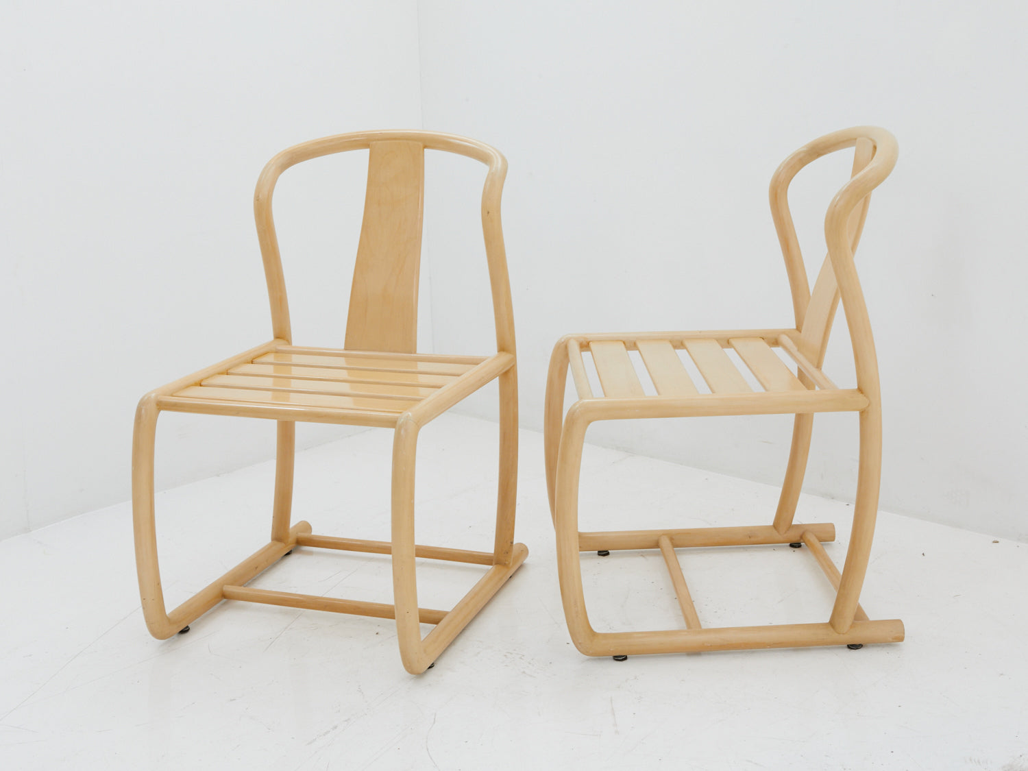 2 Italian bentwood chairs by Technosedia next to each other