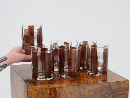Brown checked glass tumbler, set of six with hand reaching in from left